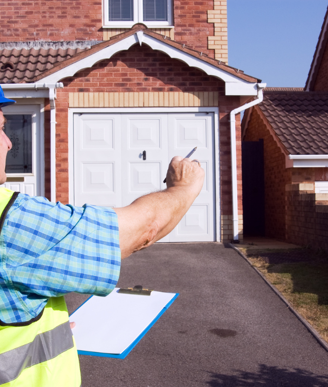 Qualified asbestos surveyor inspecting exterior of Mansfield residential property