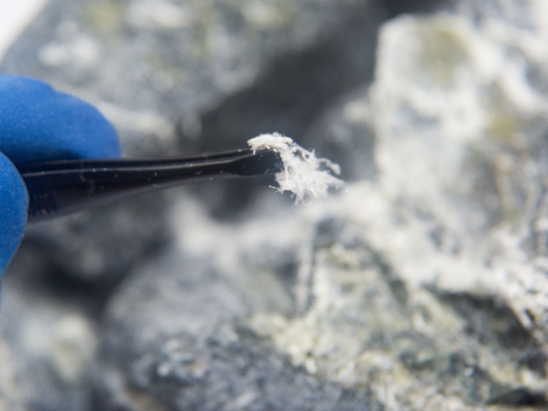 Professional safely removing asbestos fibres from commercial building in Mansfield