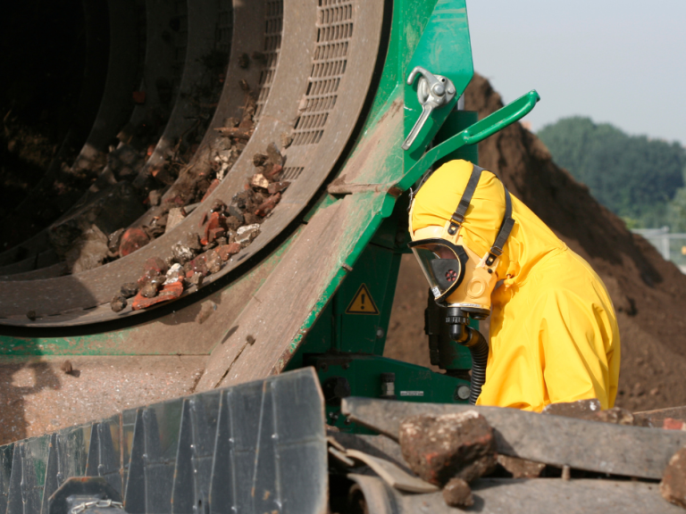 Qualified asbestos surveyor inspecting industrial site for asbestos in Mansfield
