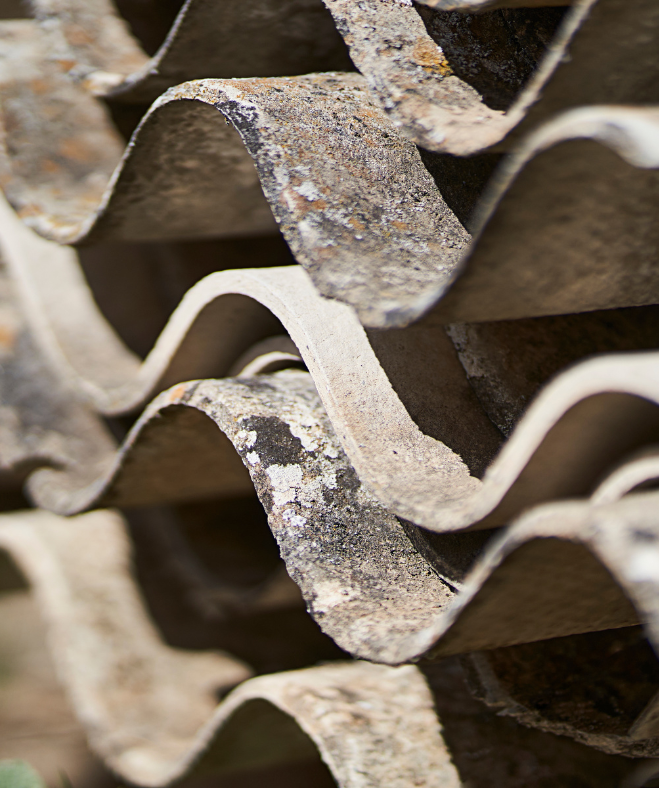 Asbestos cement sheets stacked and ready for safe disposal in Mansfield